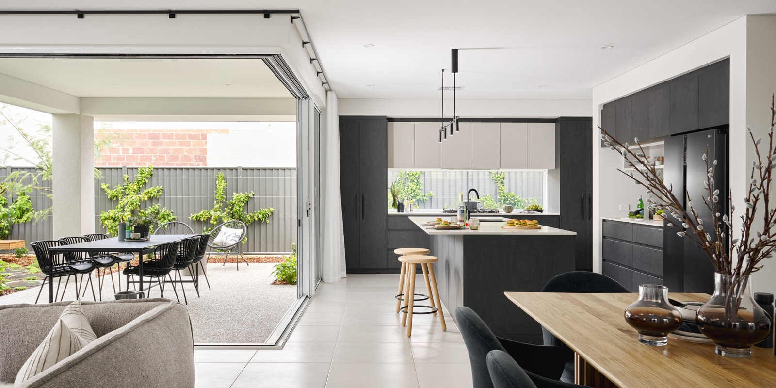 image representing the open living plan showing the connectedness of kitchen, dining, living and the outdoors. of Dale Alcock Display Home Oslo in Mindarie.